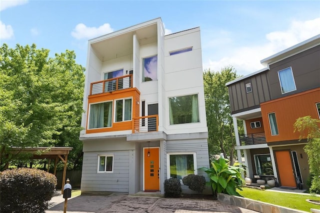 1463 Macklone St NE, Atlanta, GA 30307 - modern home featuring a balcony and stucco siding
