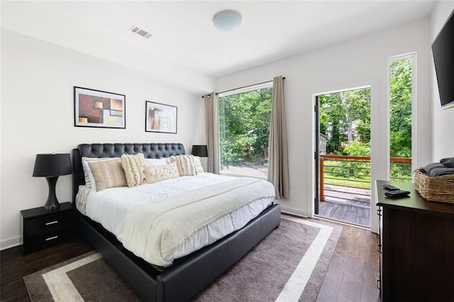 1463 Macklone St NE, Atlanta, GA 30307 - bedroom with multiple windows, access to exterior, and dark wood-style floors