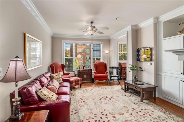 sitting room featuring crown molding, ceiling fan, and light hardwood / wood-style floors