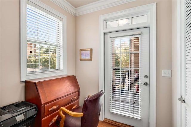 doorway to outside with ornamental molding