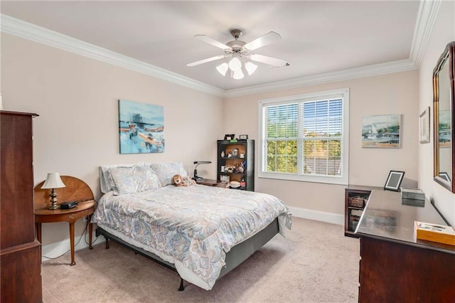 carpeted bedroom featuring ceiling fan and ornamental molding