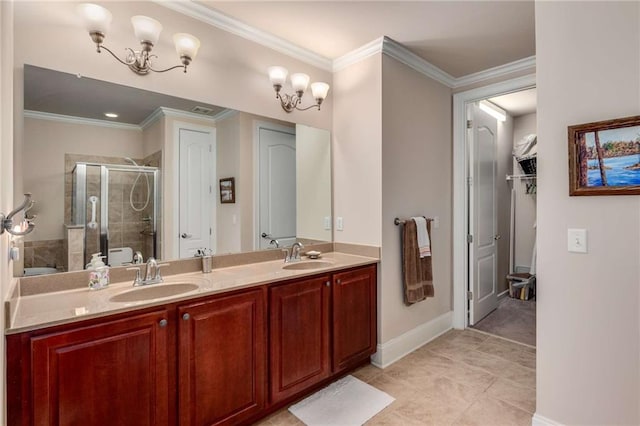 bathroom with ornamental molding, vanity, a shower with shower door, and a notable chandelier