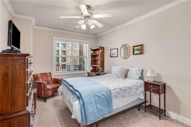 carpeted bedroom featuring ceiling fan and ornamental molding