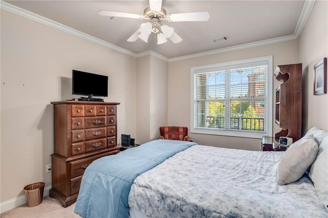 bedroom with crown molding, light carpet, and ceiling fan