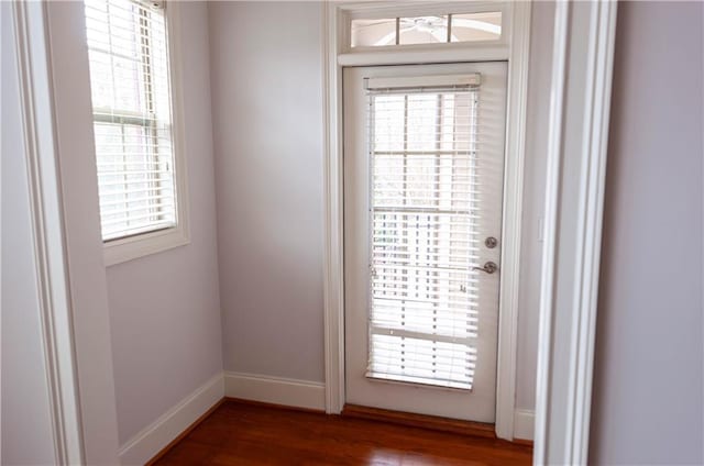 doorway to outside with wood-type flooring