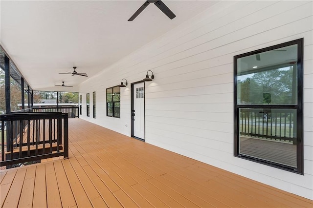 deck featuring ceiling fan and a porch