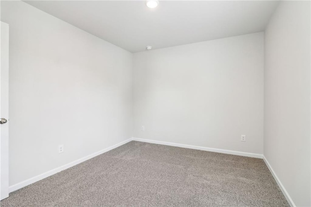 carpeted spare room with baseboards and recessed lighting