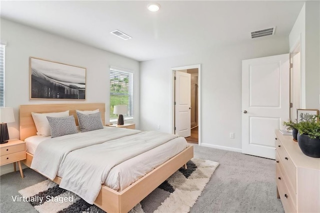 bedroom featuring baseboards, recessed lighting, light carpet, and visible vents