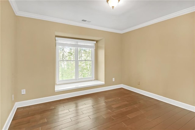 unfurnished room with crown molding and wood-type flooring