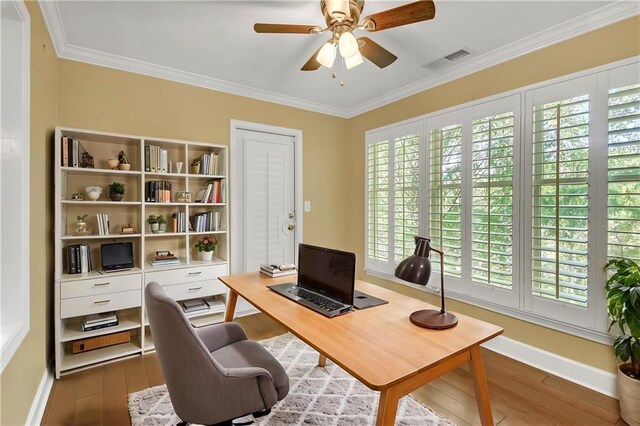 living room with crown molding, wood-type flooring, and ceiling fan