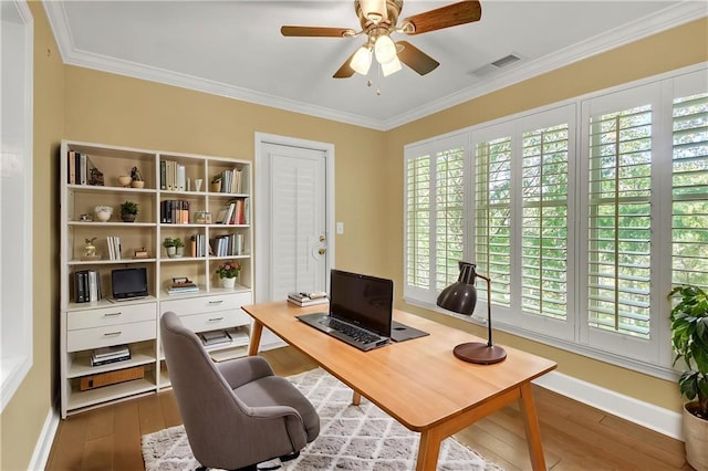 office featuring crown molding, dark wood-type flooring, and ceiling fan