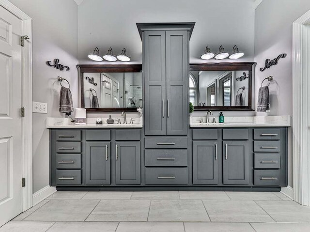 bathroom featuring tile patterned flooring and vanity