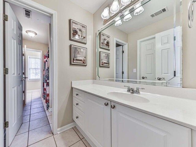 bathroom with tile patterned floors and vanity