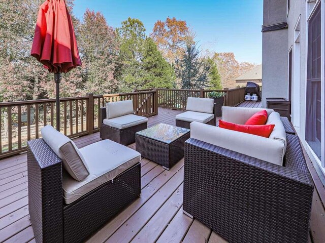 wooden deck with outdoor lounge area