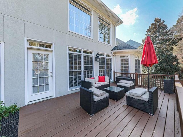 wooden terrace with outdoor lounge area