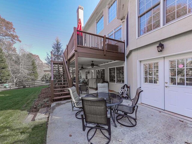 view of patio featuring ceiling fan and a wooden deck