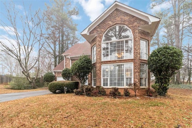 view of home's exterior with a yard