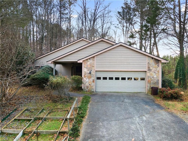 ranch-style home featuring a garage