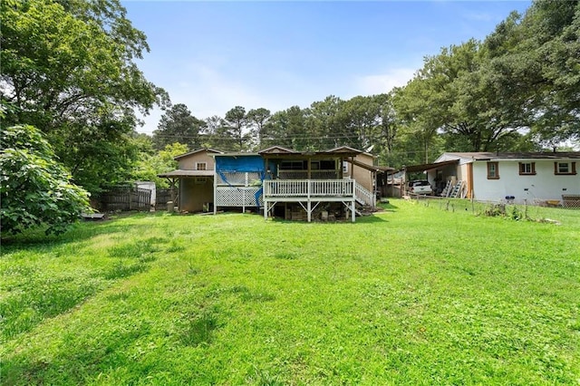 1550 Bells Ferry Rd, Marietta, GA 30066 - rear view of house with a deck and view of scattered trees