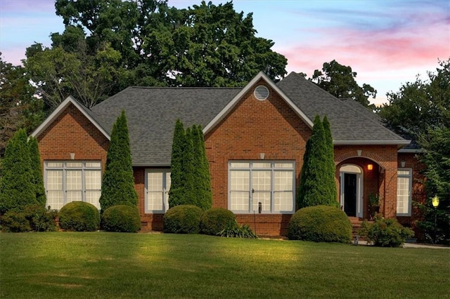 11 Crossbridge Ct SW, Cartersville, GA 30120 - view of front facade featuring a yard, brick siding, and roof with shingles
