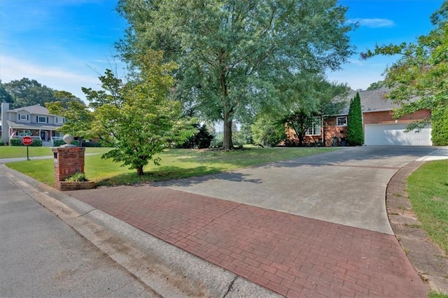 11 Crossbridge Ct SW, Cartersville, GA 30120 - view of front of home featuring driveway, a front lawn, and an attached garage