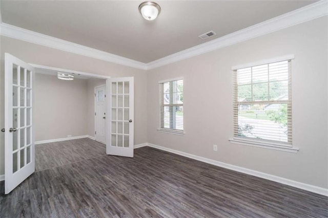 unfurnished room with french doors, dark wood finished floors, crown molding, healthy amount of natural light, and baseboards