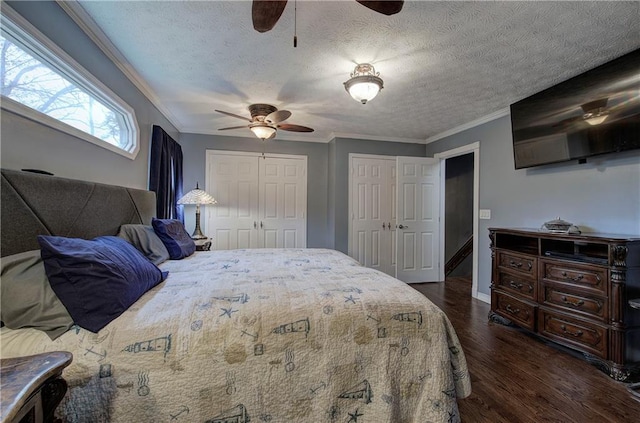 bedroom featuring dark hardwood / wood-style flooring, ceiling fan, crown molding, and a textured ceiling