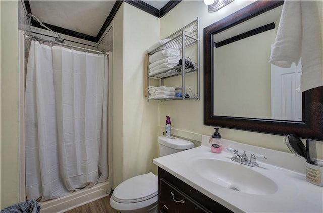 bathroom with toilet, a shower with shower curtain, vanity, and ornamental molding