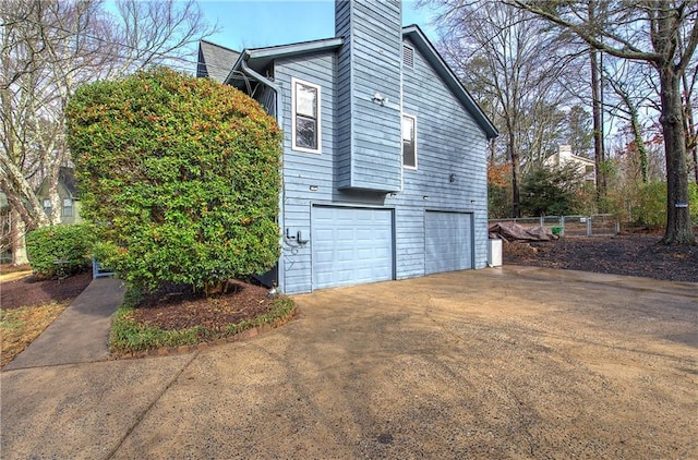 view of property exterior featuring a garage