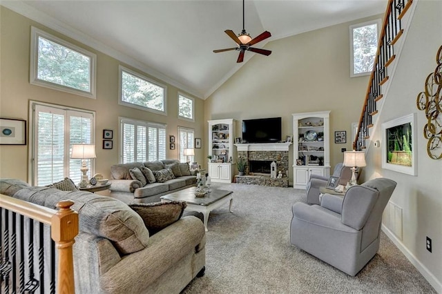 carpeted living room featuring ceiling fan, high vaulted ceiling, and a fireplace