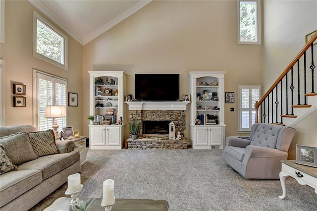 carpeted living room featuring a stone fireplace, crown molding, and high vaulted ceiling