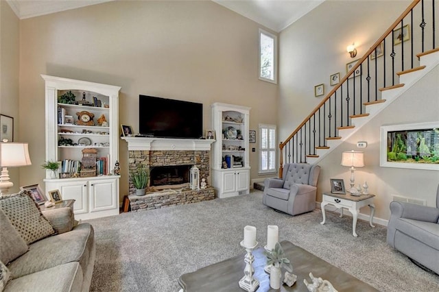 living room featuring carpet, a towering ceiling, and a fireplace