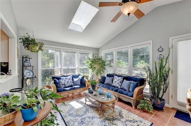 sunroom / solarium with a wealth of natural light, vaulted ceiling with skylight, and ceiling fan