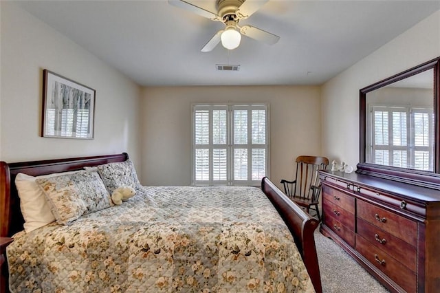 carpeted bedroom with ceiling fan