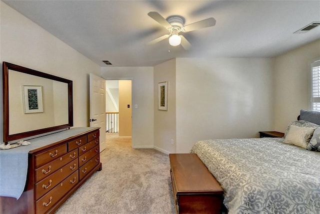 bedroom featuring ceiling fan and light colored carpet