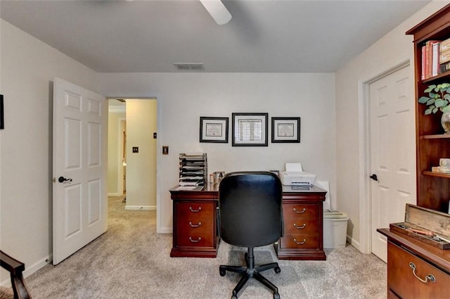 office space with light colored carpet and ceiling fan