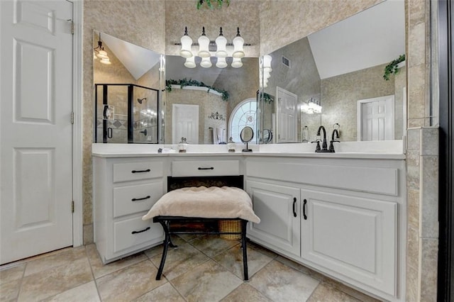 bathroom with vanity and an enclosed shower