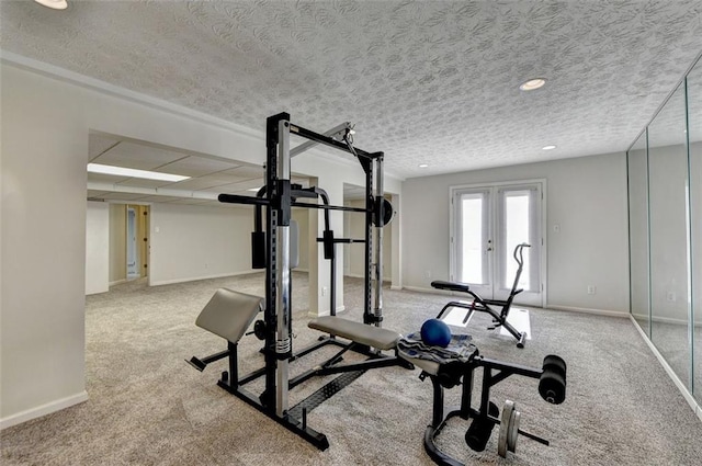 workout room with french doors, a textured ceiling, and light colored carpet