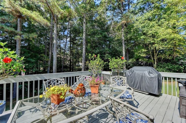 wooden terrace featuring grilling area