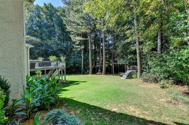 view of yard with a deck