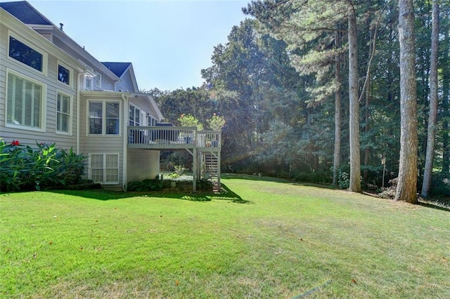 view of yard with a wooden deck