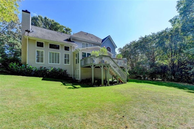 back of house featuring a yard and a deck