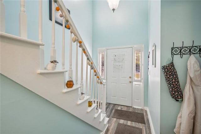 6500 Gaines Ferry Rd Unit E4, Flowery Branch, GA 30542 - foyer entrance with wood finished floors, stairs, and baseboards