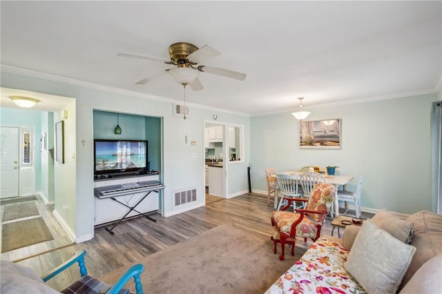 6500 Gaines Ferry Rd Unit E4, Flowery Branch, GA 30542 - living room featuring wood finished floors, crown molding, baseboards, and a ceiling fan