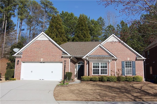 single story home featuring a garage, concrete driveway, and brick siding