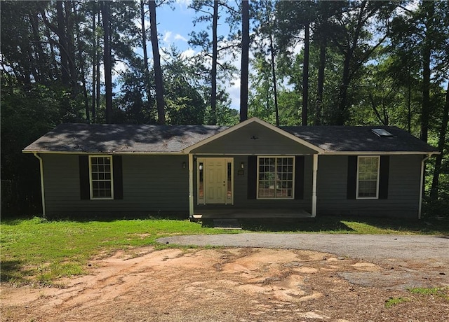 ranch-style house featuring covered porch