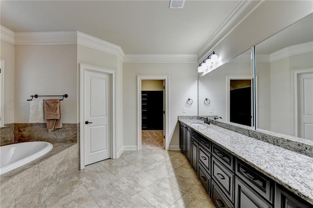 bathroom featuring a garden tub, visible vents, ornamental molding, vanity, and baseboards