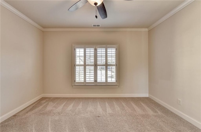 carpeted empty room featuring baseboards, visible vents, ceiling fan, and ornamental molding