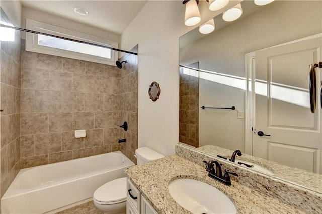 bathroom with shower / washtub combination, vanity, and toilet