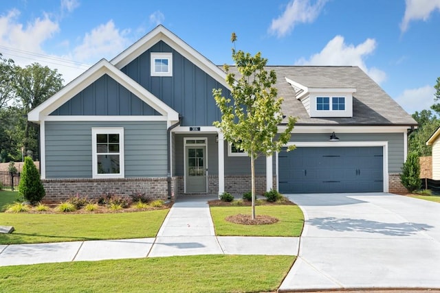 craftsman-style house with a front yard and a garage